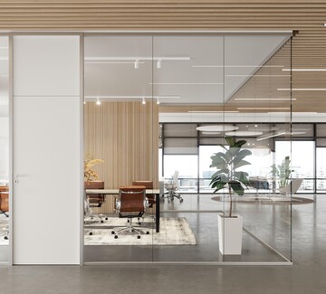 Et lyst og moderne kontor afskærmet med SCANWALLS med en trædør installeret